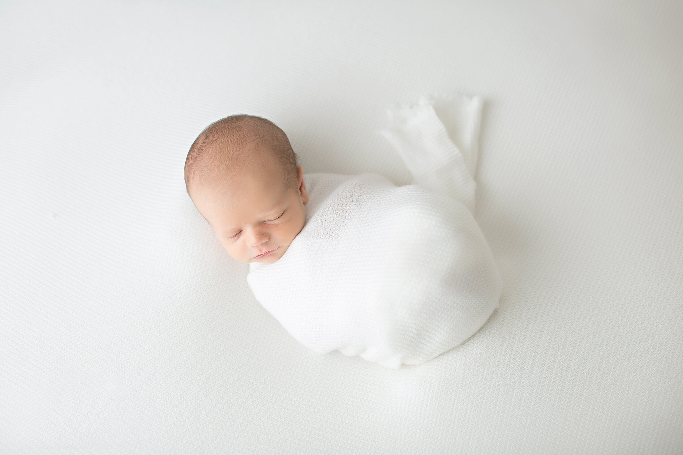 newborn baby wrapped  photography