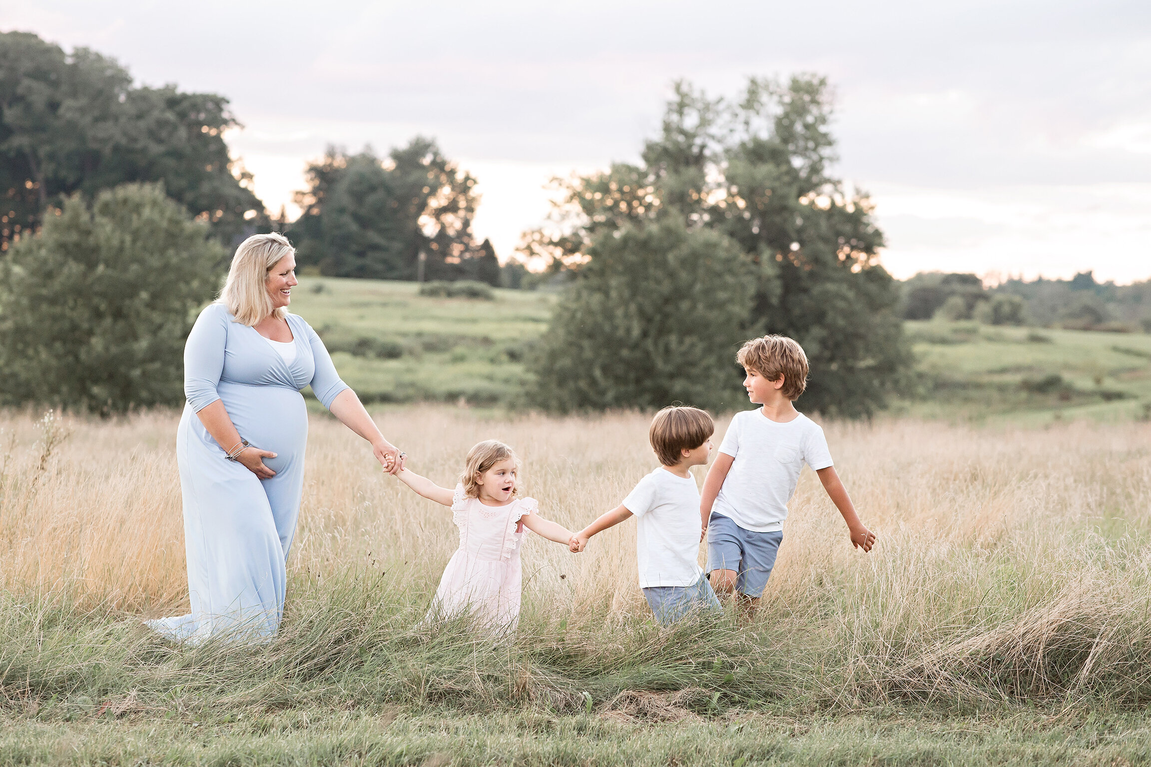 Mom in field with kids maternity photographer philadelphia pa