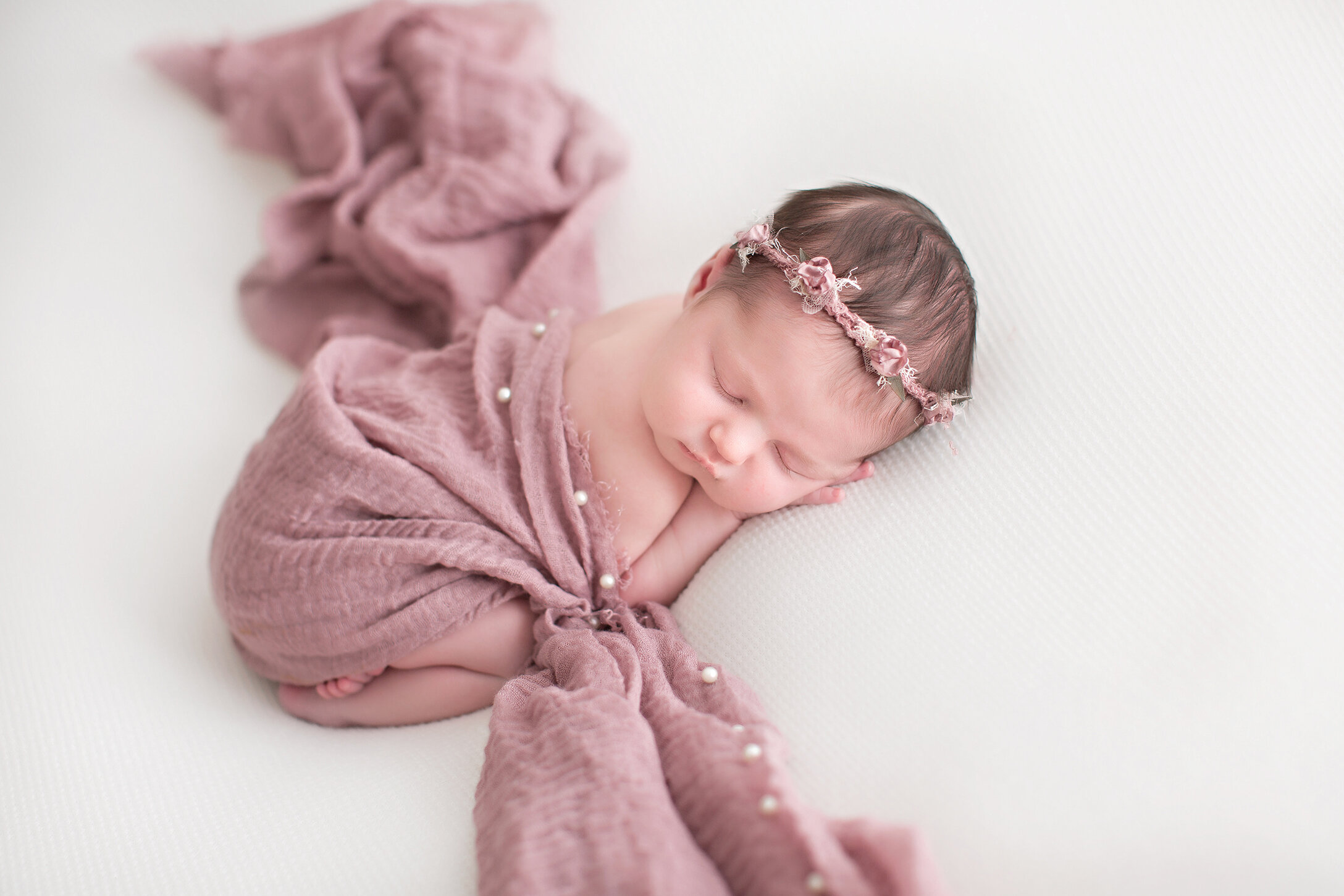 baby girl wrapped in pink philadelphia newborn photographer