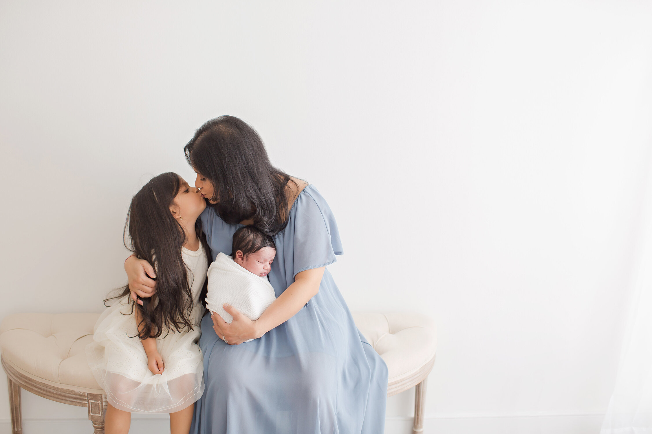 Mom kissing children philadelphia newborn photographer