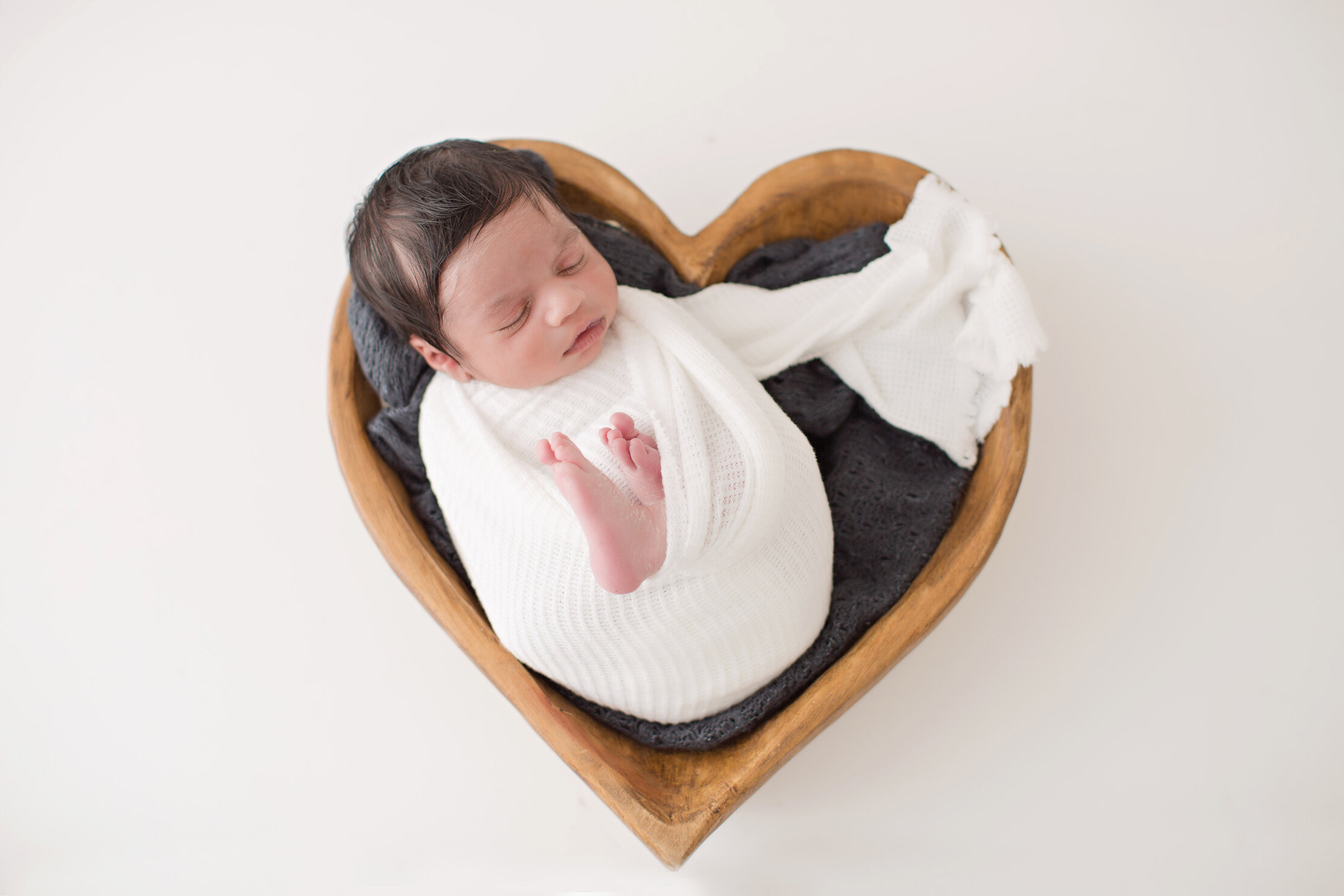 newborn in heart shaped bowl bucks county pa