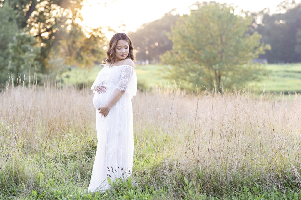 pregnant woman in field for maternity photography 