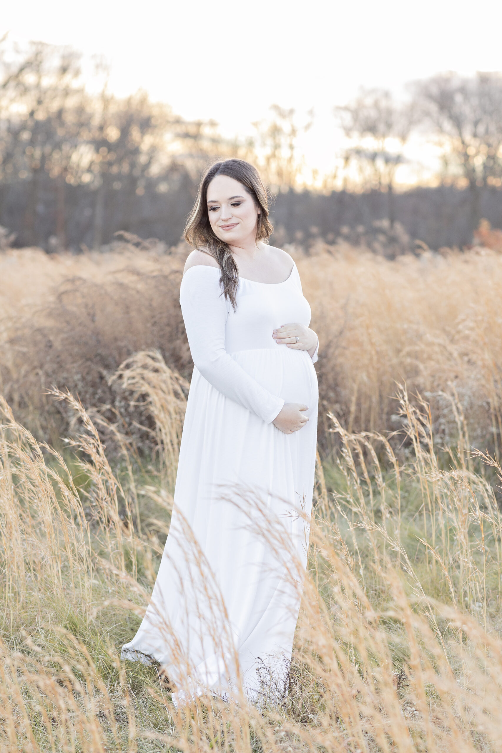 pregnant mom wearing white dress maternity photos philadelphia