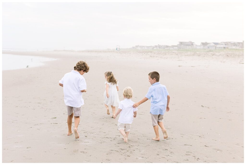 kids chasing each other down beach in Ocean City, NJ