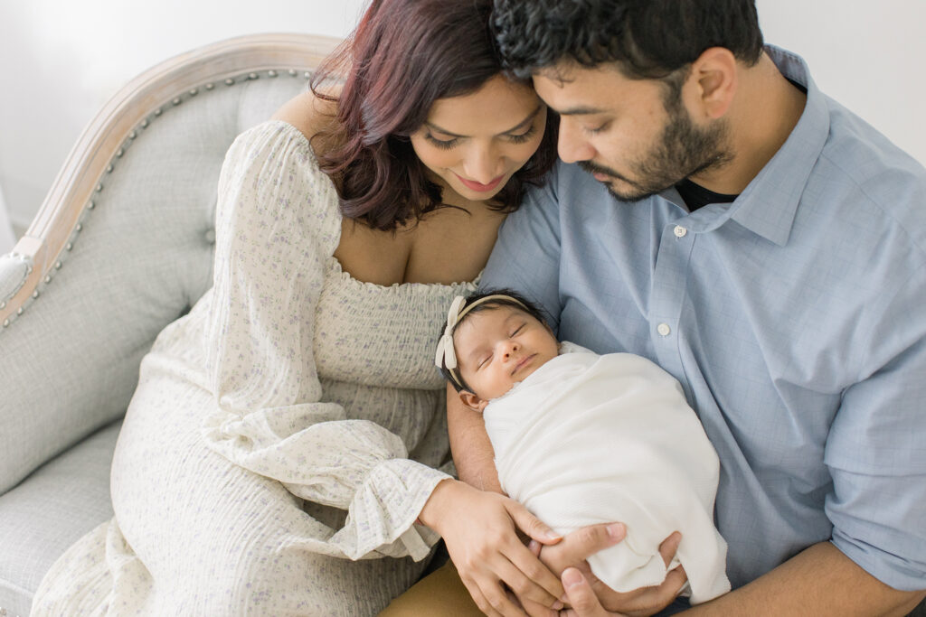 parents holding baby girl newborn photography philadelphia
