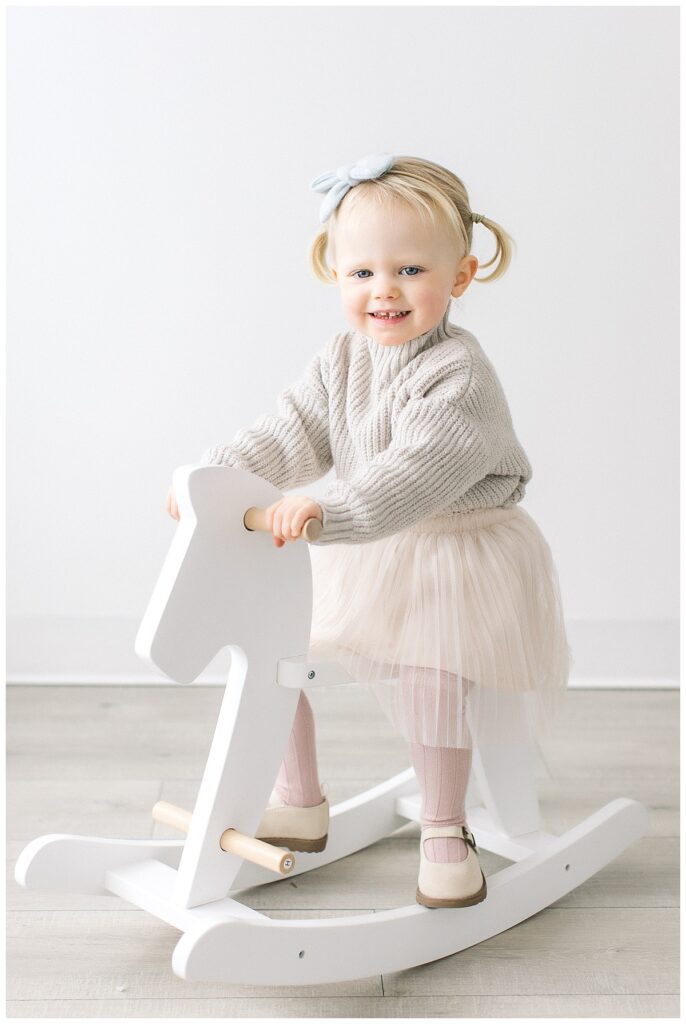 2 year old on rocking horse photography session newtown pa 