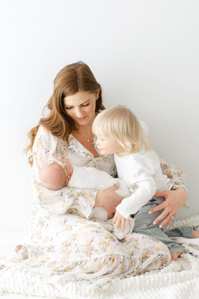 mom with son and baby girl newborn portraits philadelphia 