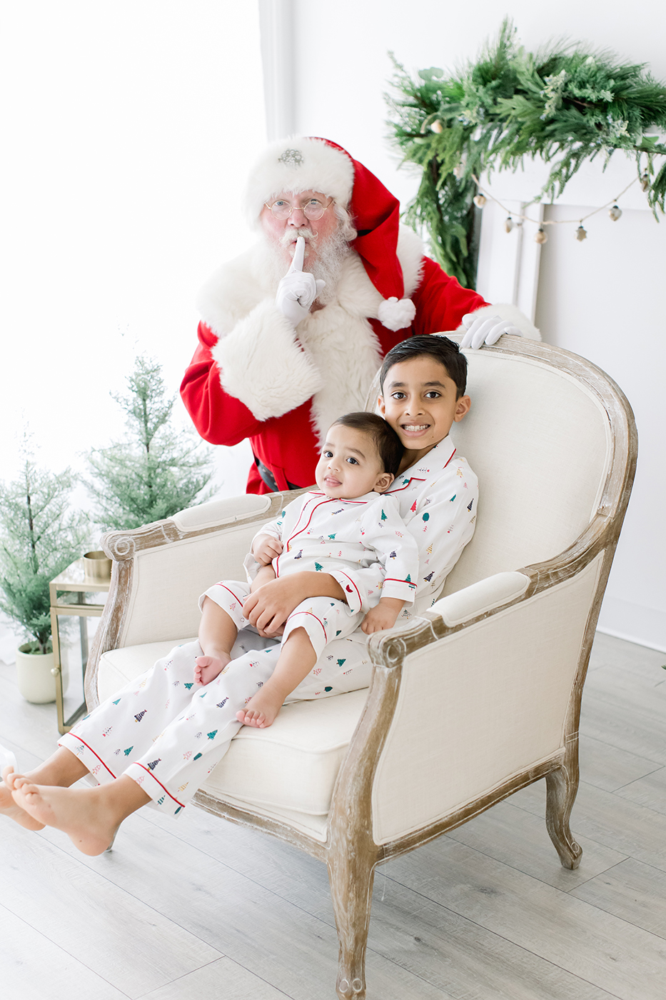 brothers sitting on chair with santa newtown photographer