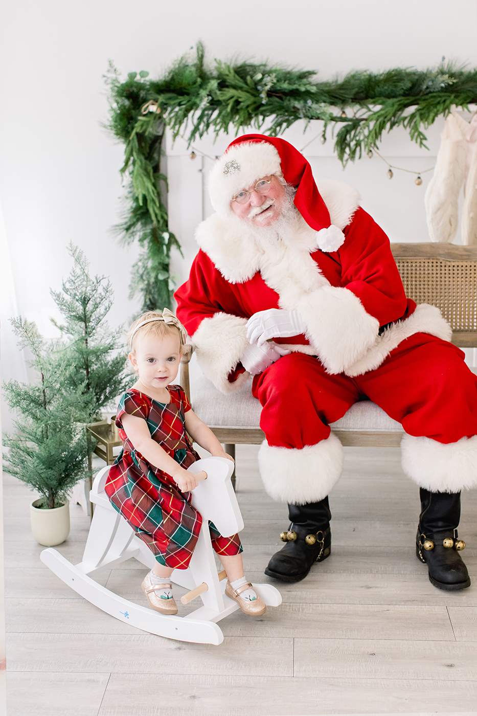 santa with little girl on rocking horse