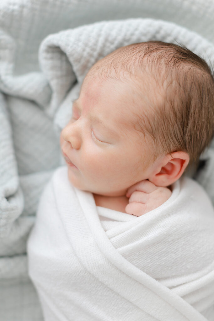 newborn in white swaddle philadelphia studio session